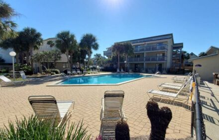 Charming 1Br Condo on the beach with pool outside back door and beach access.