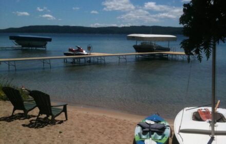 Lakefront Cottage with 100′ Sandy Beach on Crystal Lake